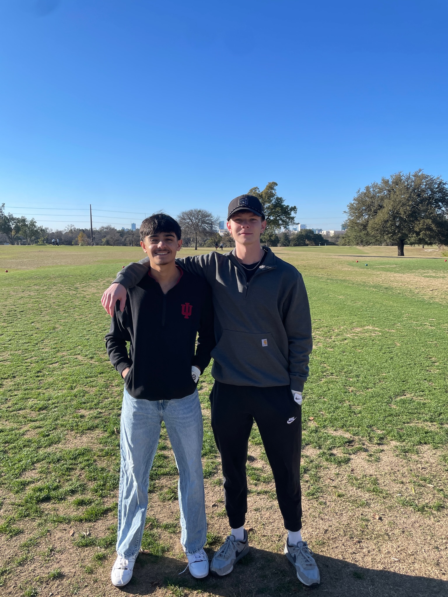 Logan Priebe and Kian Kouhestani on the golf course